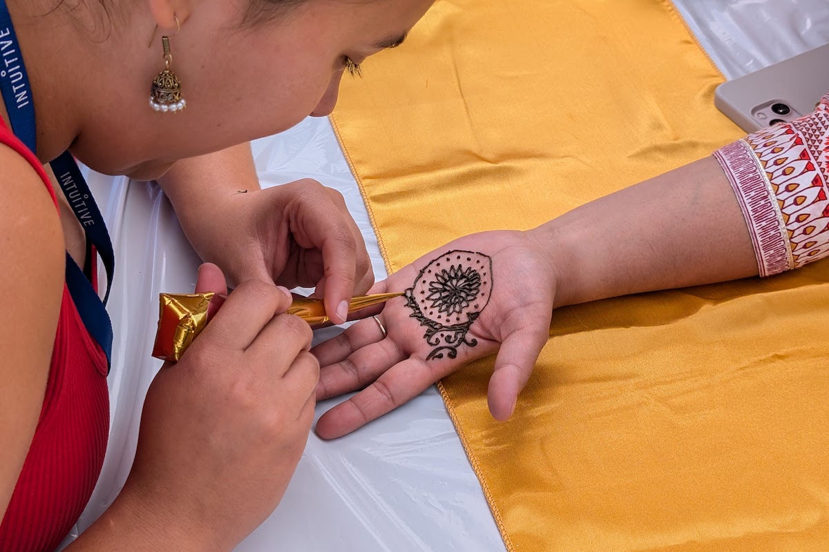 woman drawing on hand