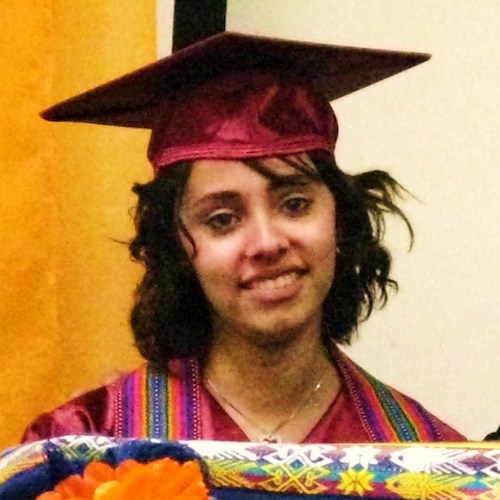 teary-eyed young woman in grad cap 