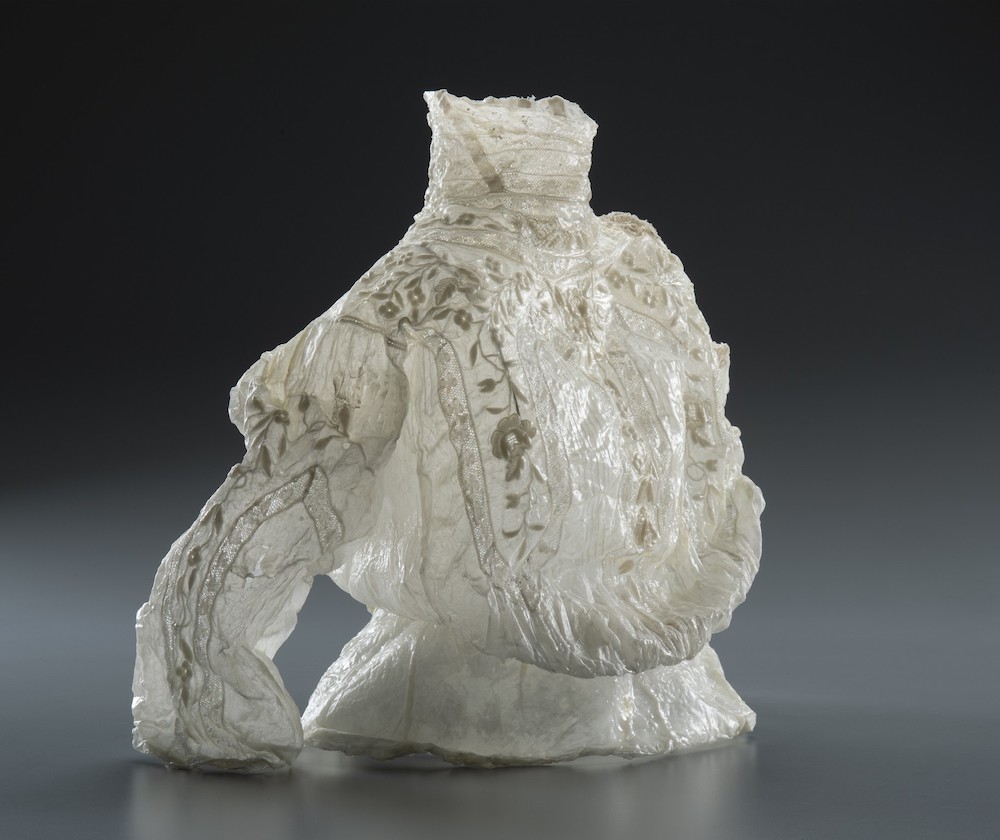 woman's white lacy blouse with high neck