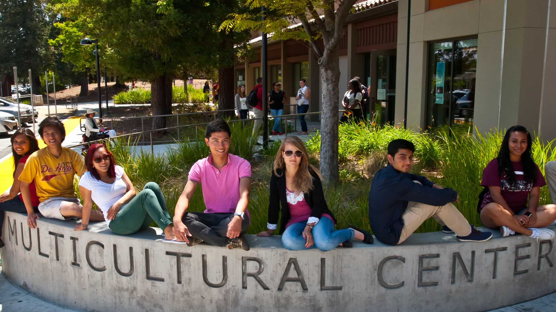 Students on the Multicultural Center sign