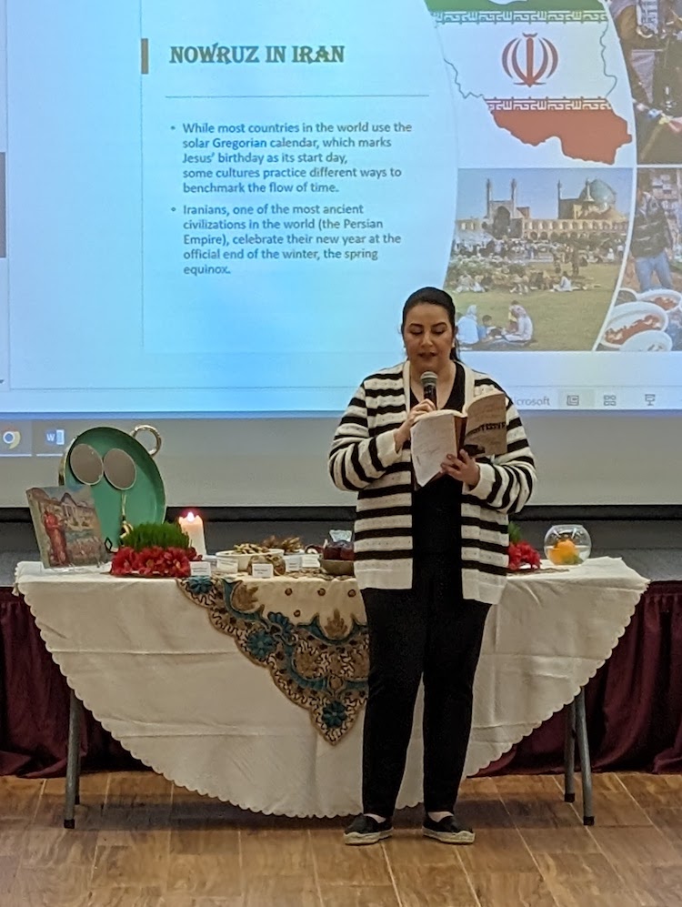 woman talking in front of screen