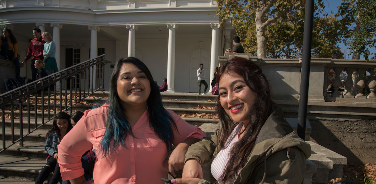 two students on steps in Sunken Garden