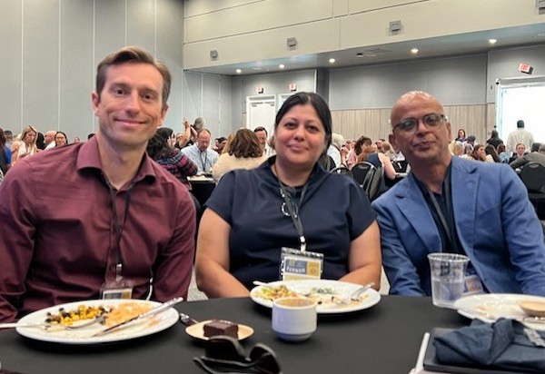 Sam Bliss, Shagun Kaur, Ram Subramaniam at conference room table