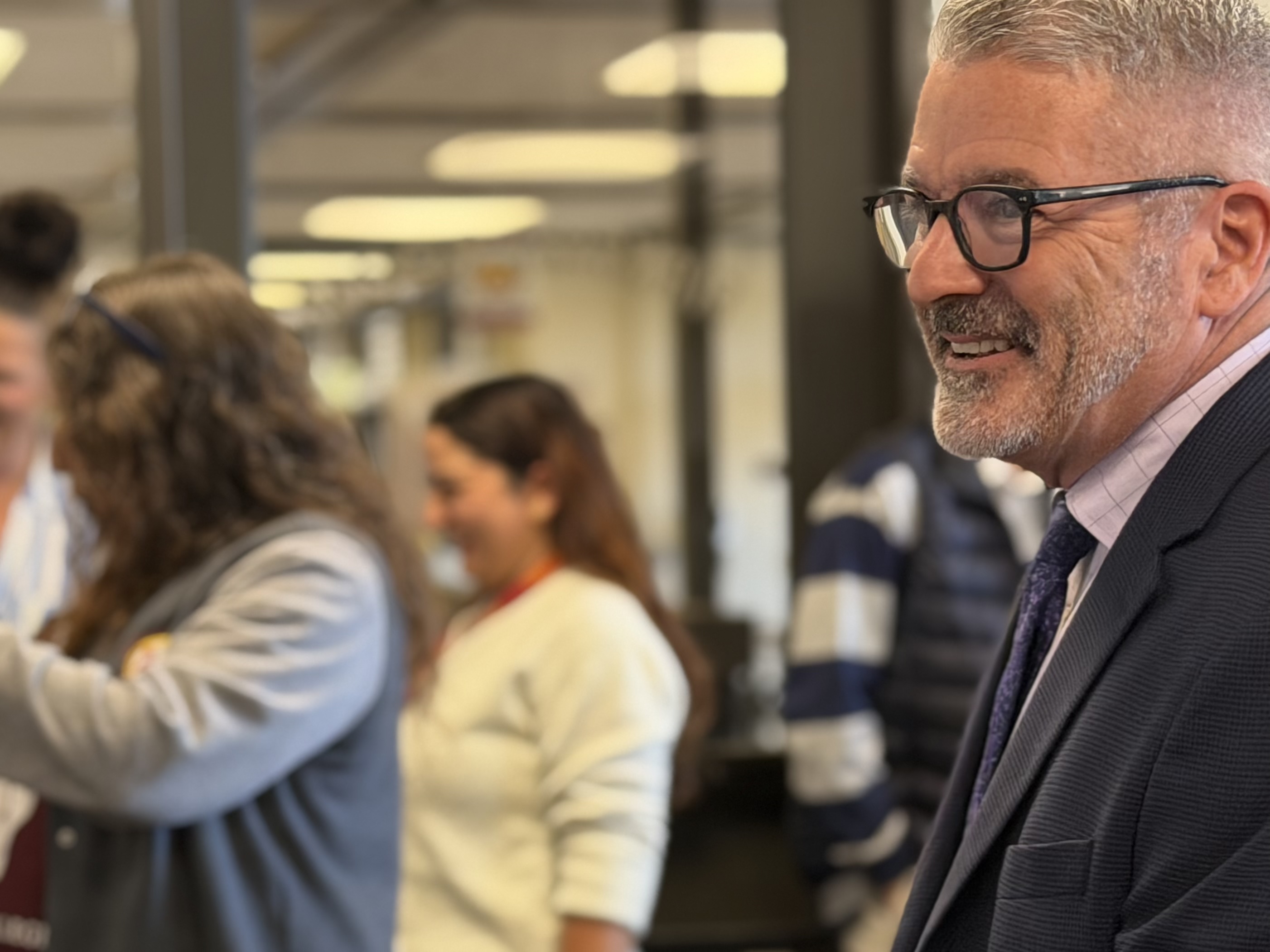 acting president coon greets the campus community