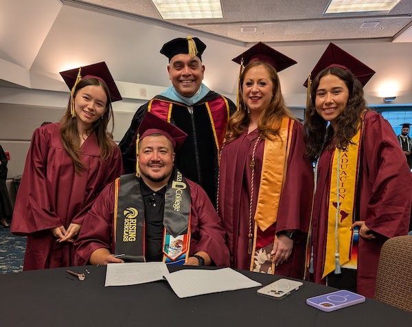 President Torres with grads