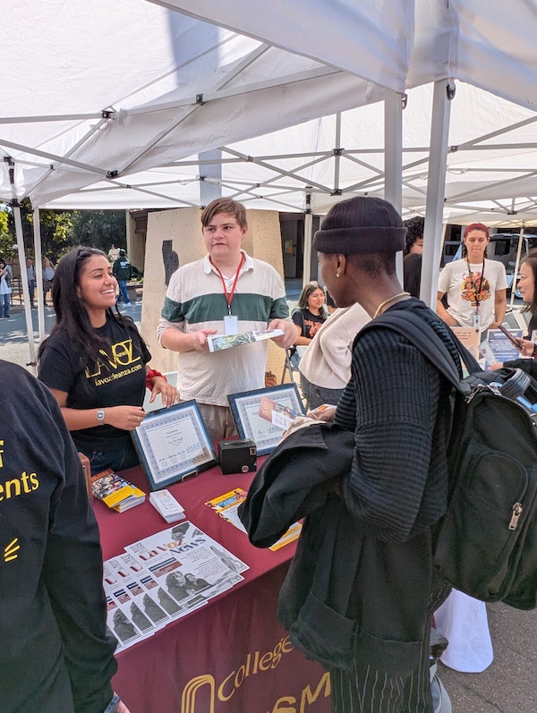 woman at table with student